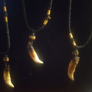 4 wolf's tooth necklaces